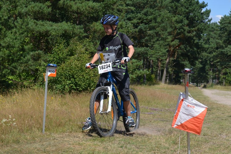 A young rider passing a control.